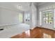 Bright, airy living room with hardwood floors, large windows, and fresh neutral paint at 617 Wexford Ct, Acworth, GA 30102