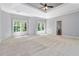 Spacious main bedroom with tray ceiling, carpet flooring, and large windows at 617 Wexford Ct, Acworth, GA 30102