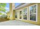 Back of home with an outdoor patio, large windows, and a partial view of the yard, perfect for entertaining at 782 Ridgeland Trl, Clarkston, GA 30021