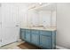 Well-lit bathroom features a large mirror above a double vanity and ample storage in a neutral color palette at 782 Ridgeland Trl, Clarkston, GA 30021