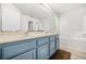 Bathroom boasts a double sink vanity, a soaking tub, and a separate shower stall for a spa-like experience at 782 Ridgeland Trl, Clarkston, GA 30021