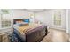 Bright bedroom with laminate flooring, windows that provide natural light, and space for relaxation and personalization at 782 Ridgeland Trl, Clarkston, GA 30021