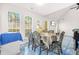 Dining area featuring large windows, adjacent to the living room with fireplace, offers views of outdoor at 782 Ridgeland Trl, Clarkston, GA 30021