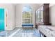 Bright dining area with large arched window, blue tiled floors, and classic furniture providing an inviting space at 782 Ridgeland Trl, Clarkston, GA 30021