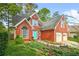 Beautiful brick home with well-kept landscaping, blue shutters, and a two-car garage enhancing curb appeal at 782 Ridgeland Trl, Clarkston, GA 30021