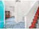 Inviting foyer with a blue door, patterned tiled floor, and a staircase leading to the upper level at 782 Ridgeland Trl, Clarkston, GA 30021