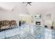 Comfortable living room with fireplace, vaulted ceiling, and tile floors leading to dining area at 782 Ridgeland Trl, Clarkston, GA 30021