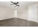 A well-lit bedroom with ceiling fan and modern wood-look flooring at 1158 Crystal Lake Rd, Atlanta, GA 30349