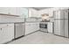 Well-appointed kitchen featuring stainless steel appliances, white cabinets, and subway tile backsplash at 1158 Crystal Lake Rd, Atlanta, GA 30349