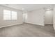Neutral living space with ample natural light, hardwood floors, and a versatile layout at 1158 Crystal Lake Rd, Atlanta, GA 30349