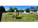 Large backyard with playground, in-ground pool, outbuilding, trampoline and lots of green grass at 116 Ridge Xing, Temple, GA 30179