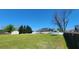 Expansive backyard with in-ground pool, outbuilding, deck, trampoline and lots of green grass at 116 Ridge Xing, Temple, GA 30179
