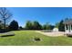 Large backyard featuring green grass, a trampoline, in-ground pool and an outbuilding at 116 Ridge Xing, Temple, GA 30179