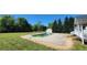 In-ground pool in large backyard with a shed, patio, and green grass at 116 Ridge Xing, Temple, GA 30179