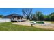 Backyard boasts a refreshing pool, a pergola-covered deck, and well-maintained greenery at 116 Ridge Xing, Temple, GA 30179