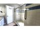 Bathroom showcasing glass-enclosed shower with blue accent tiles, grab bar and granite vanity at 116 Ridge Xing, Temple, GA 30179