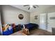 Bedroom with personalized decor, featuring a bed and rocking horse on a carpeted floor at 116 Ridge Xing, Temple, GA 30179