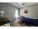 Bedroom with personalized decor, featuring a bed, desk, and window on a carpeted floor at 116 Ridge Xing, Temple, GA 30179