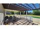 Covered deck overlooking the pool and backyard, perfect for outdoor entertaining at 116 Ridge Xing, Temple, GA 30179