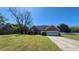 Traditional brick home with an attached two-car garage and well-manicured front lawn at 116 Ridge Xing, Temple, GA 30179
