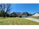 Charming brick home featuring an attached garage, manicured lawn, and well-maintained landscaping at 116 Ridge Xing, Temple, GA 30179