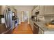 Kitchen with stainless steel appliances, granite countertops, wood flooring and gray cabinets at 116 Ridge Xing, Temple, GA 30179