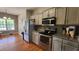 Eat-in kitchen features stainless appliances, granite countertops, and light gray cabinets at 116 Ridge Xing, Temple, GA 30179