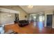Spacious living room with hardwood floors connects to the kitchen and dining areas at 116 Ridge Xing, Temple, GA 30179
