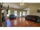 Bright living room featuring hardwood floors and a vaulted ceiling with ample natural light at 116 Ridge Xing, Temple, GA 30179