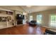 Cozy living room featuring a fireplace, built-in shelving, and abundant natural light at 116 Ridge Xing, Temple, GA 30179
