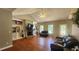 Open living room features a fireplace, built-in shelving, and abundant natural light at 116 Ridge Xing, Temple, GA 30179