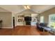 Living room features a cozy fireplace, custom built-ins, and large windows at 116 Ridge Xing, Temple, GA 30179