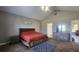 Main bedroom showcasing a vaulted ceiling, a ceiling fan, and natural light at 116 Ridge Xing, Temple, GA 30179