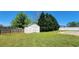 Shed in backyard on a large lot with a lush green lawn and fenced perimeter at 116 Ridge Xing, Temple, GA 30179