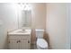 Well-lit bathroom with a vanity, toilet, and neutral color scheme at 4510 Trumble Ter, Snellville, GA 30039