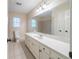Large bathroom with vanity, big mirror, and decorative wall tile at 4510 Trumble Ter, Snellville, GA 30039