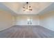 Spacious bedroom featuring neutral walls, plush carpet, and a modern ceiling fan at 4510 Trumble Ter, Snellville, GA 30039