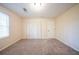 Bedroom with carpet and double door closet at 4510 Trumble Ter, Snellville, GA 30039