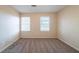 This cozy bedroom features plush carpet and two bright windows with blinds at 4510 Trumble Ter, Snellville, GA 30039