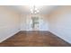 This dining room features hardwood floors and opens to the kitchen through french doors at 4510 Trumble Ter, Snellville, GA 30039