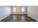 This dining room has hardwood floors and updated lighting with wainscotting at 4510 Trumble Ter, Snellville, GA 30039