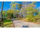 Charming two-story brick home with a long driveway surrounded by lush trees and greenery at 4510 Trumble Ter, Snellville, GA 30039