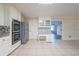 Bright kitchen featuring granite countertops, modern stainless steel appliances, and tile flooring at 4510 Trumble Ter, Snellville, GA 30039