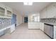 Bright kitchen featuring granite countertops, modern stainless steel appliances, and tile flooring at 4510 Trumble Ter, Snellville, GA 30039
