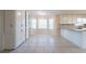 The kitchen features white cabinetry, tile floors and a sunny breakfast nook at 4510 Trumble Ter, Snellville, GA 30039