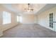 Large primary bedroom with neutral paint and carpet at 4510 Trumble Ter, Snellville, GA 30039
