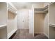 Spacious walk-in closet with carpet flooring and ample white shelving at 4510 Trumble Ter, Snellville, GA 30039