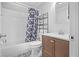 Clean bathroom featuring a tub/shower combo and patterned tile flooring at 69 Country Place Ct, Alpharetta, GA 30005