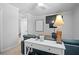 Bedroom area showing a sleeper sofa, desk, and mounted TVs at 69 Country Place Ct, Alpharetta, GA 30005