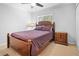 Bedroom with natural light and hardwood furniture at 69 Country Place Ct, Alpharetta, GA 30005